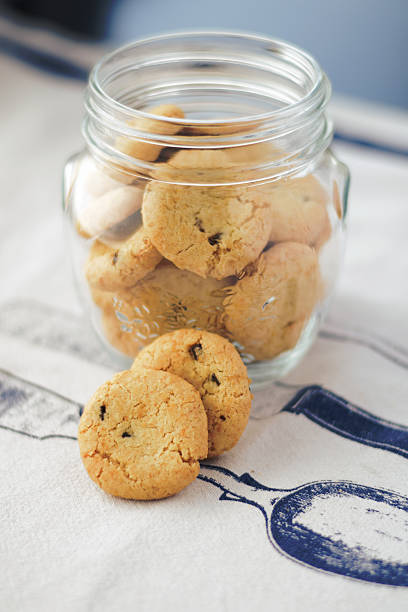istock Cookies in glass jar on white napkin, kitchen 491790088