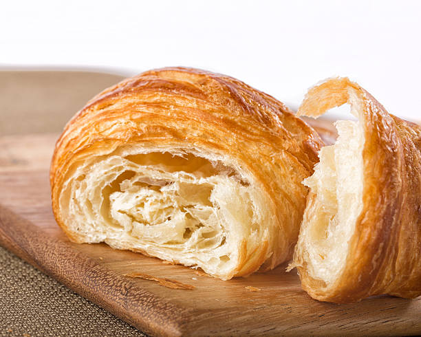 istock Flaky french croissant pulled apart 491794080