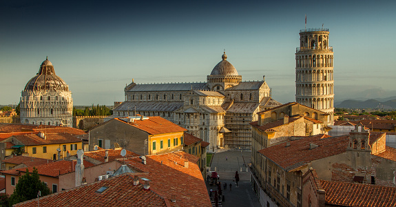 A view of Pisa's Cathedral Square, featuring the Cathedral, the Tower and the Baptistery, taken just after sunrise.