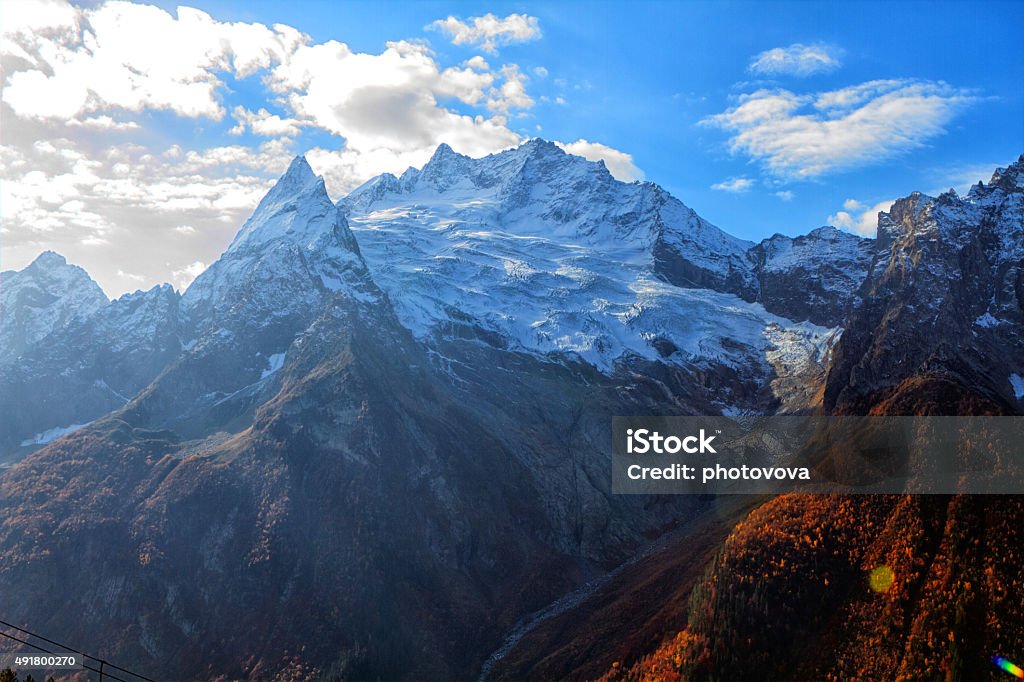 Landscape of mountains Landscape of mountains Caucasus region in Russia Mountain peaks in clouds. Caucasus. Dombay. 2015 Stock Photo