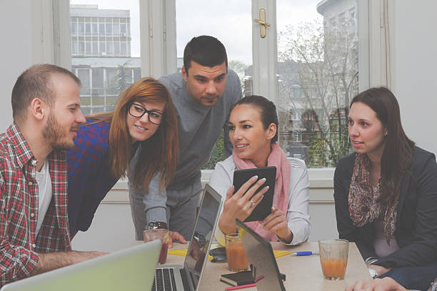 istock Young group of people discussing business plans 491800706