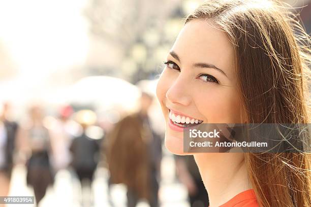 Woman Face Smile With Perfect Teeth Looking You Stock Photo - Download Image Now - 2015, Adult, Backgrounds
