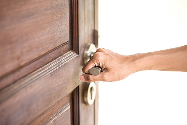 istock hand hold handle of wood door 491804890