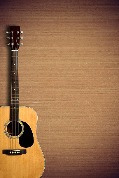 istock Acoustic guitar on wooden background 491805022