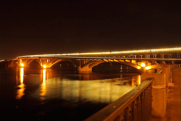 istock Bridge over river with reflection of lights in water 491805650