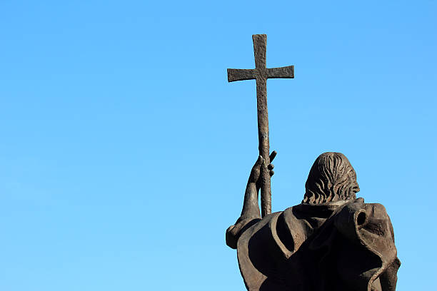 istock monument of a man with a cross on sky background 491810682