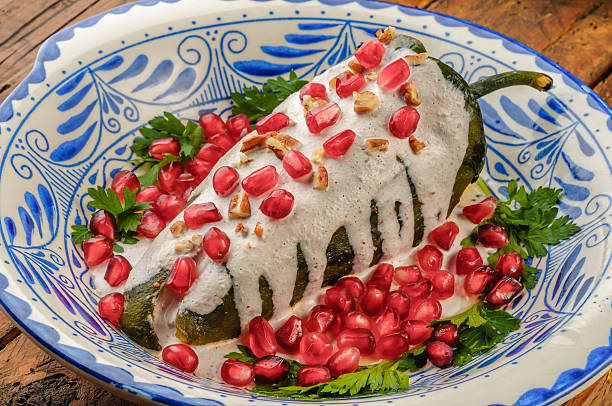 Chiles en nogada - Mexican food Chiles en nogada, a dish from Mexican cuisine ground beef photos stock pictures, royalty-free photos & images