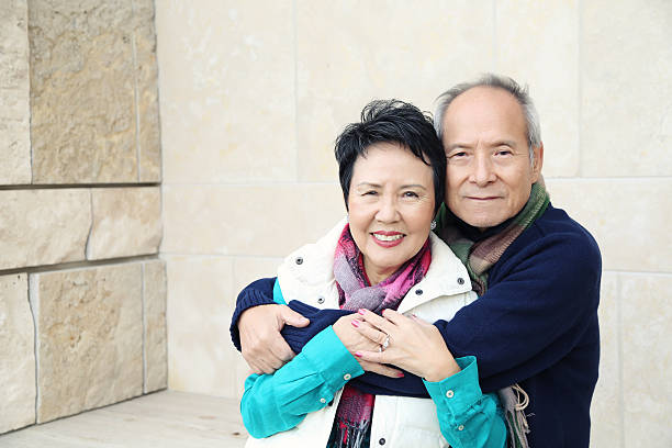 istock Asian Couple in Embrace 491811614