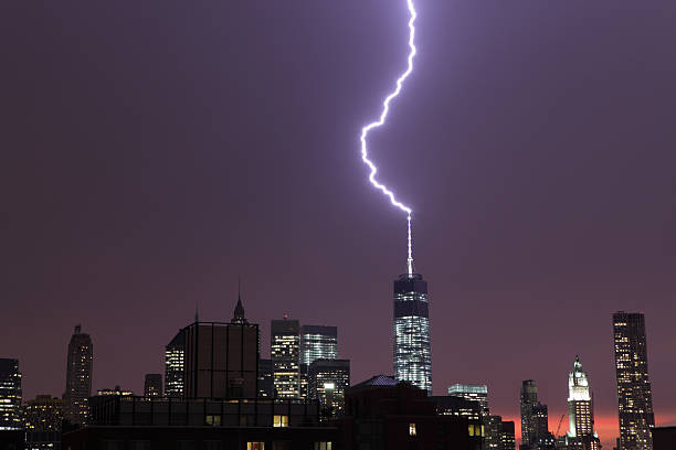 Lightning strikes the World Trade Center NYC Lightning from a heavy thunderstorm over Manhattan strikes One World Trade Center 6 times over a period of 1 hour in July 2014. lightning tower stock pictures, royalty-free photos & images