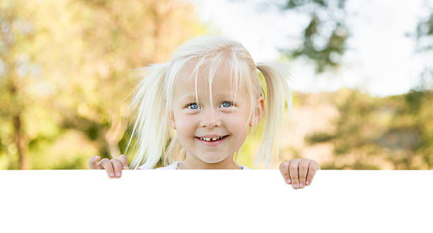 istock Cute Little Girl Holding White Board with Room For Text 491813002