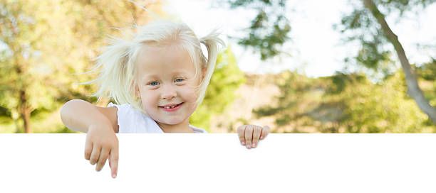 istock Cute Little Girl Holding White Board with Room For Text 491813014
