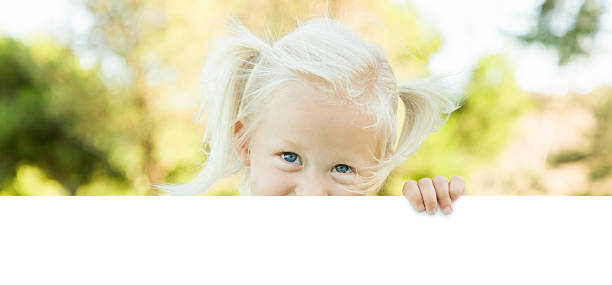 istock Cute Little Girl Holding White Board with Room For Text 491813070