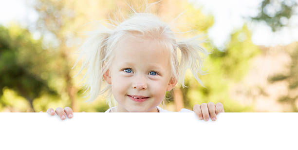 istock Cute Little Girl Holding White Board with Room For Text 491813078