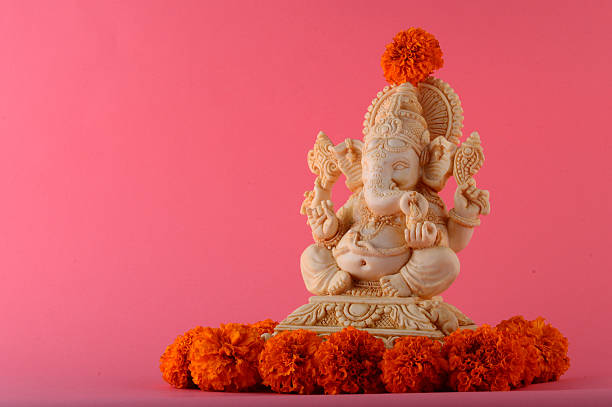 istock Hindu God Ganesha. Ganesha Idol on pink Background. 491815400