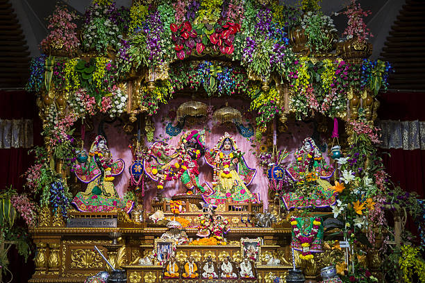 ISKCON Temple, New Delhi - CNGLTRV1109 New Delhi, India - September 10, 2015 : Idols of Lord Ram, Laxman and Sita along with Hanuman at ISKCON Temple, New Delhi. Idol worship is highly prevalent in this part of the world. The idols are bathed every day and adorned with ornate dress and decorated with flowers every day. radha krishna stock pictures, royalty-free photos & images