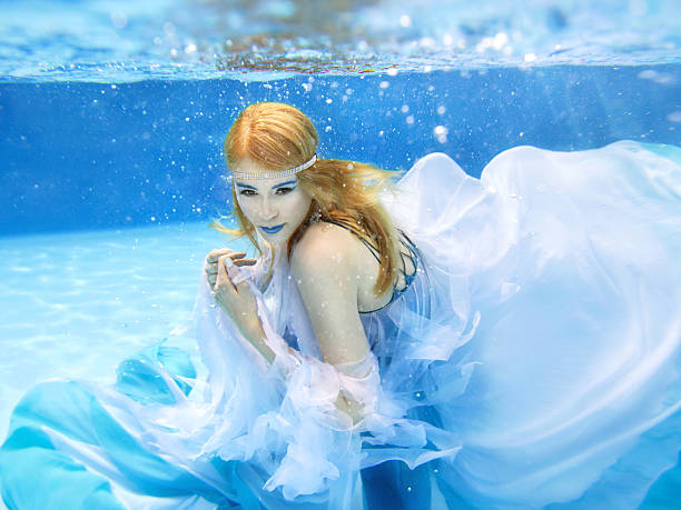 istock blonde young beautiful woman as air element underwater 491816632