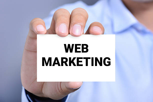 istock WEB MARKETING message on the card shown by a man 491817408