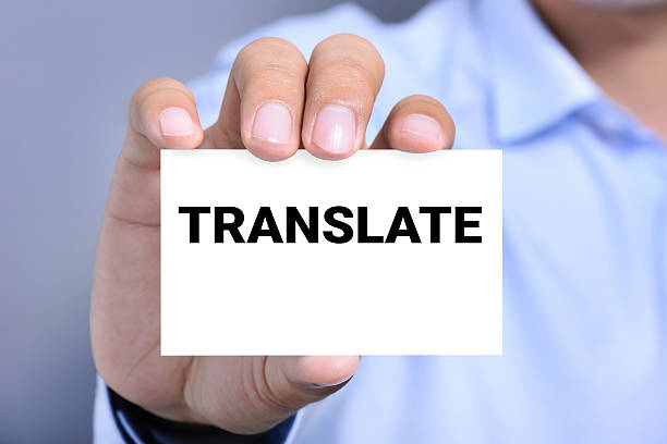 istock TRANSLATE word on the card held by a man hand 491817476