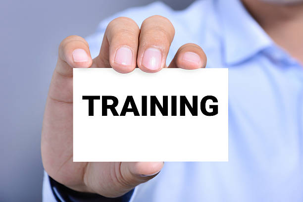 istock TRAINING word on the card shown by a man 491817512