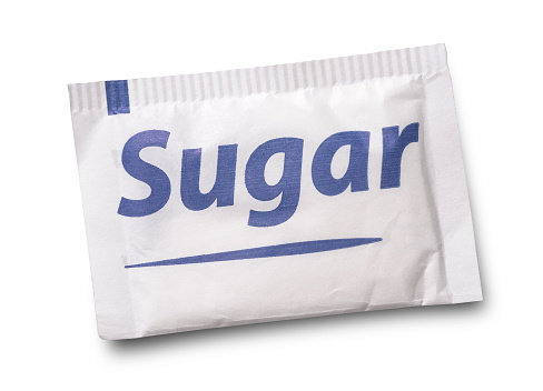 Small sugar packet isolated on white