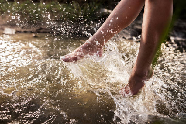 istock Unrecognizable woman splashing water with her legs. 491825126