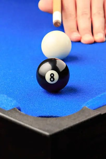 Match ball. Black eight ball in the pocket.