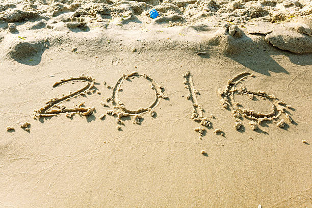 istock Year 2016 on the beach for background 491827848