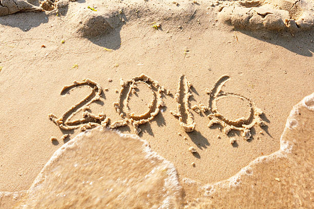 istock Year 2016 on the beach for background 491827856