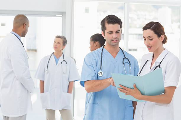 istock Team of doctors working on their files 491828578