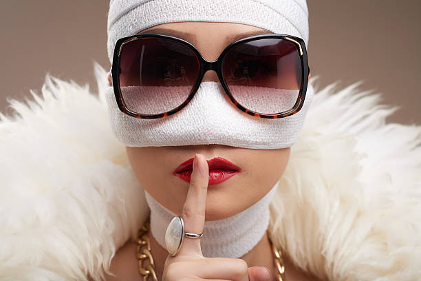 Secret of youth Woman wants to keep her plastic surgery in secret human nose stock pictures, royalty-free photos & images