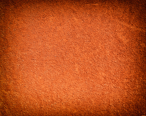 Tennis court background with red clay sand