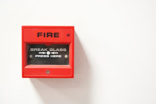Red Fire alarm box on white background.