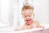 istock happy funny  baby  laughing and bathed in bath 491837795