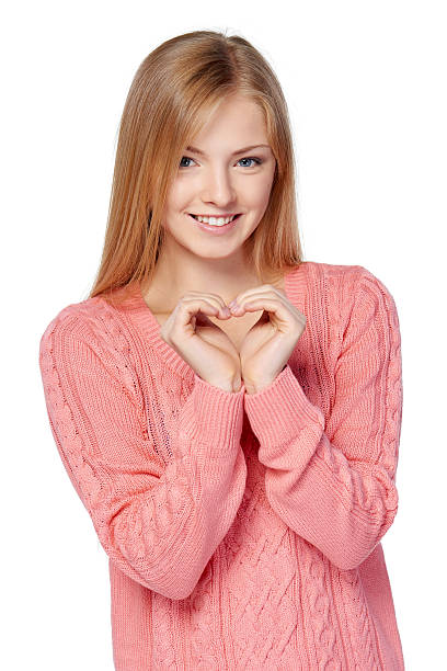 istock Smiling female showing heart with hands 491838216