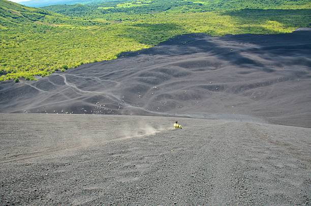 istock Sandboarding Down Cerro Negro Volcano In Nicaragua 491838449