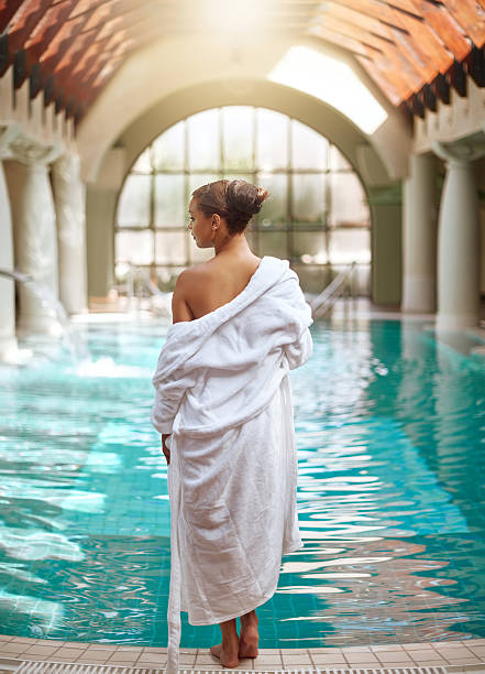 Shot of a young woman relaxing by the pool at a spahttp://195.154.178.81/DATA/i_collage/pi/shoots/805701.jpg