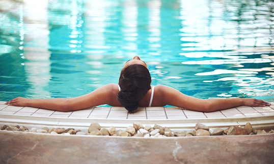 Shot of a young woman relaxing in the pool at a spahttp://195.154.178.81/DATA/i_collage/pi/shoots/805701.jpg