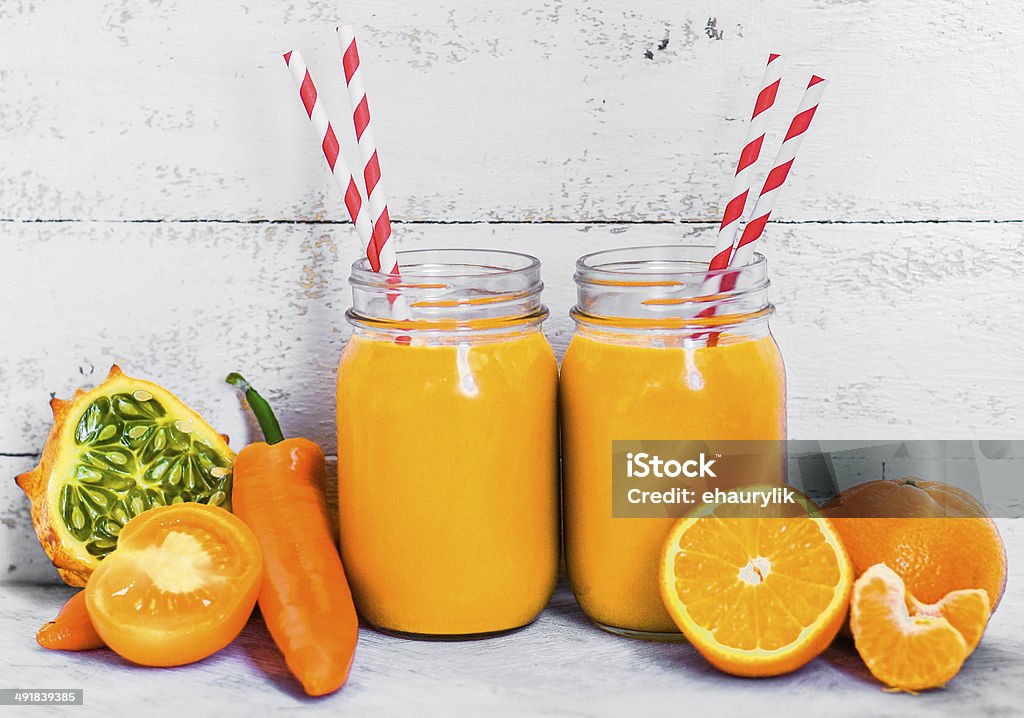 Orange smoothie on rustic background Backgrounds Stock Photo