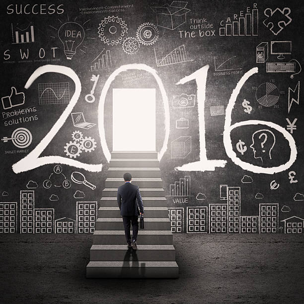 istock Worker looking at the door to future with numbers 2016 491840434
