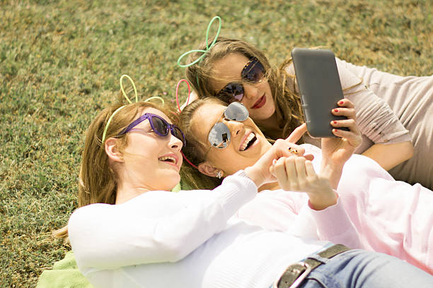 istock Young girls using tablet and cell phone 491840889