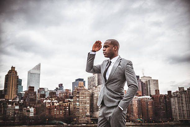 istock Successful business man looking away against the skyline 491841270