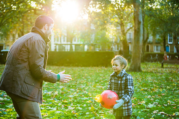 istock Father and daughter having fun in park 491841304