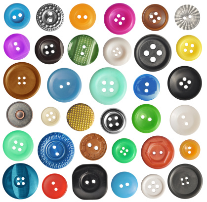 collection of various buttons on white background. each one is shot separately