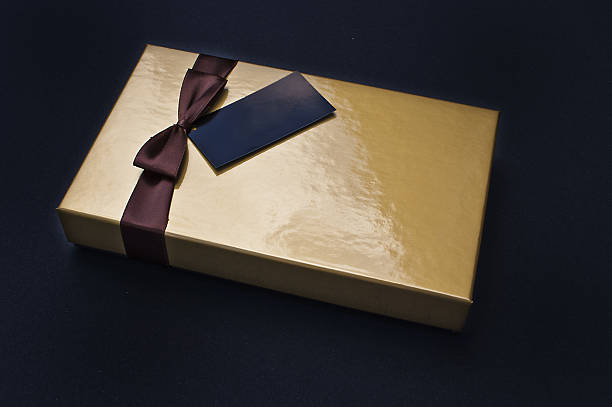 istock Golden chocolate box closed with black label 491854308
