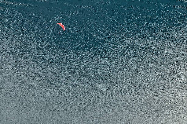 istock Paraglider flying above the sea 491855760