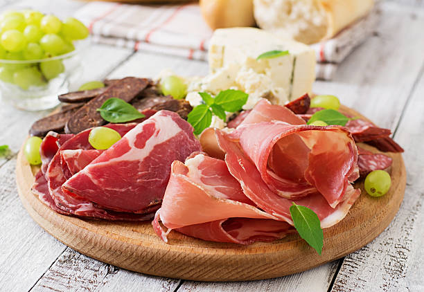 istock Antipasto catering platter with bacon, jerky, sausage, blue cheese 491856710