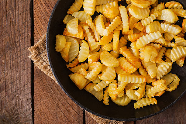 istock Frying pan with a fried potato in a rural way 491857406