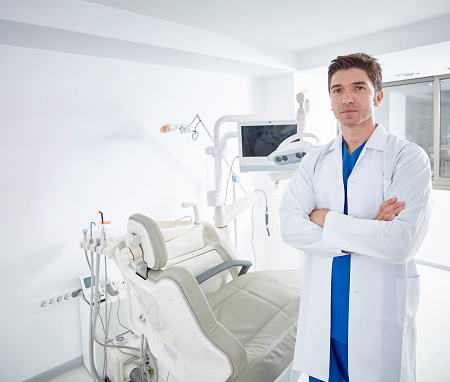 Dentist smiling in office