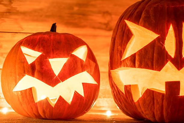 istock two vibrant spooky illuminated halloween pumpkins 491869692