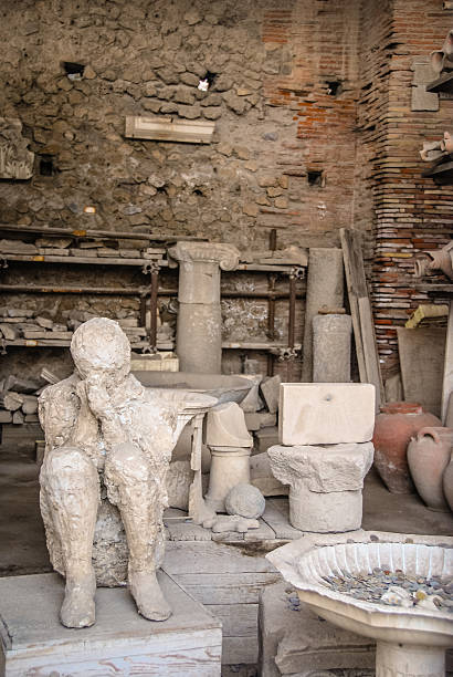 Plaster Cast of Pompeii Citizen A cast of one of the victims of the eruption of Mt. Vesuvius in 79AD. victims the ruins of pompeii stock pictures, royalty-free photos & images